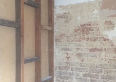 Bedroom wall stripped, ready for plaster boarding
