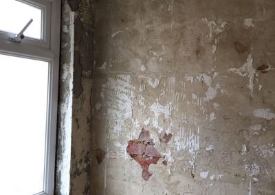 Bathroom wall before repair